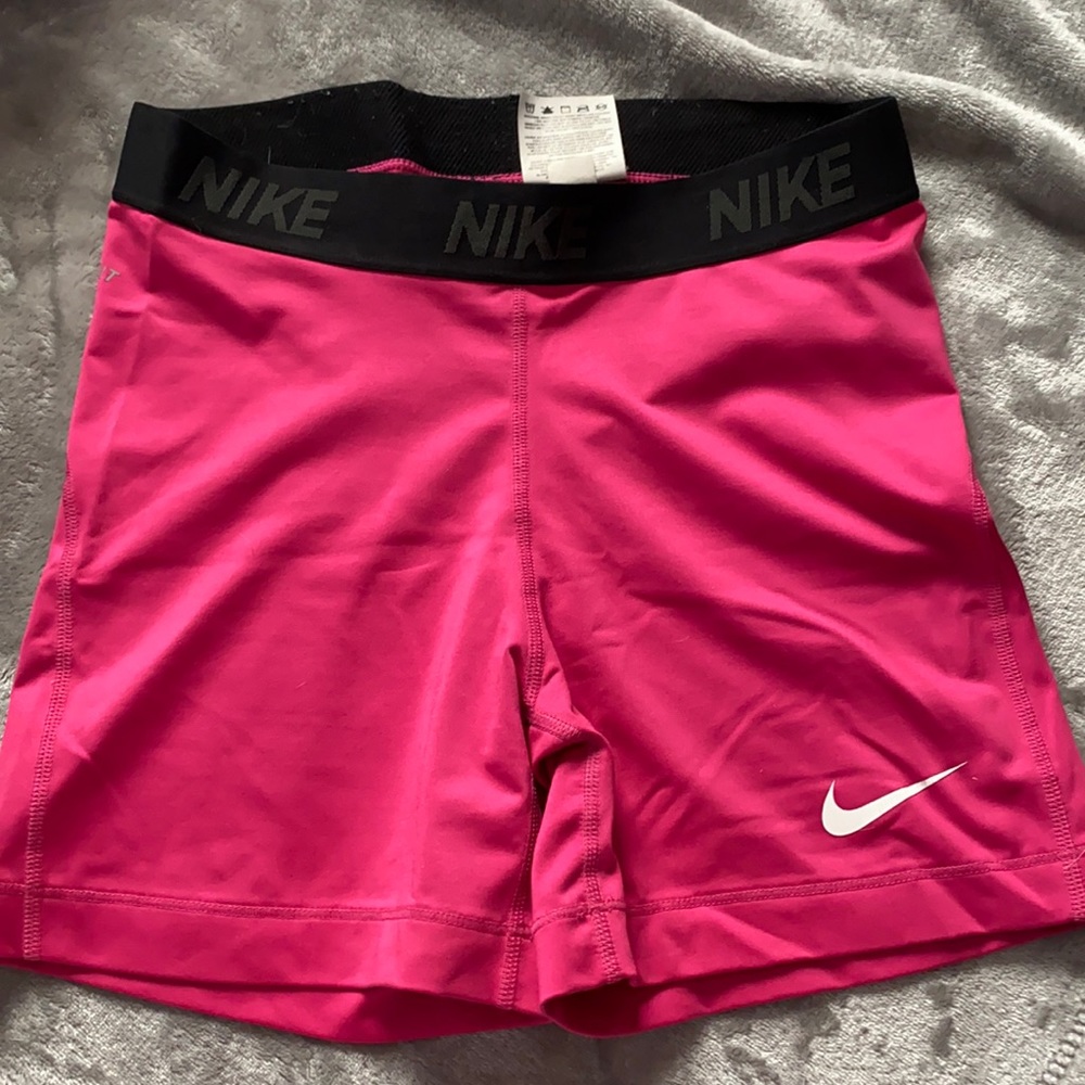 Pink and black Nike pros